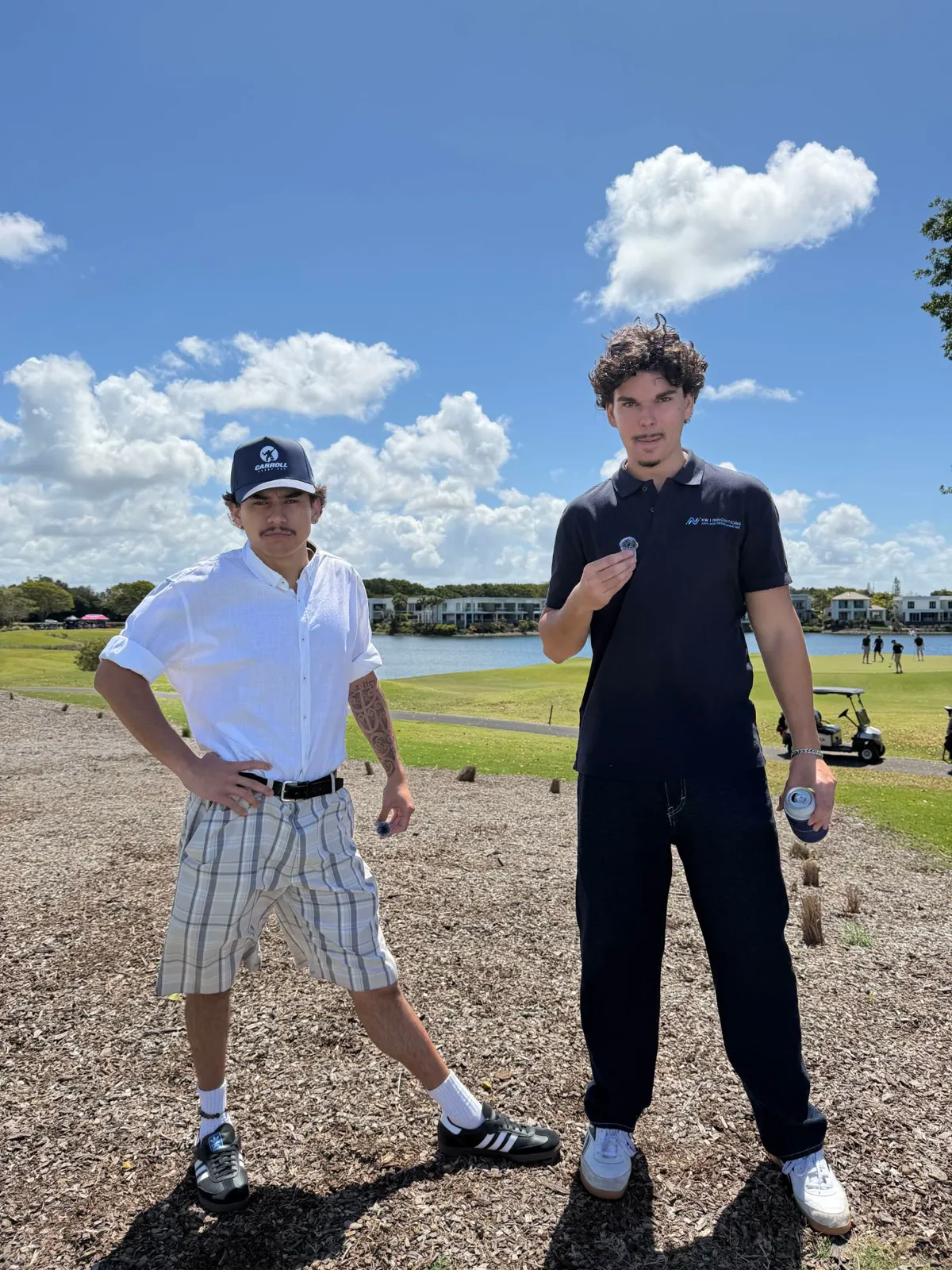 Two of the team on the course at Links Hope Island, one in a KW Innovations polo